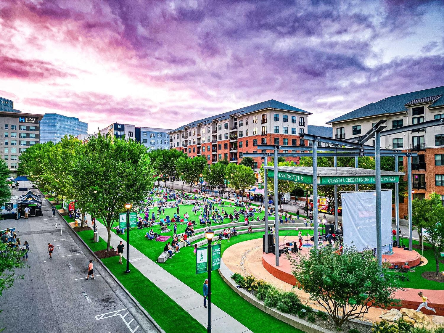 Midtown Raleigh park concert — community gathering at an outdoor amphitheater